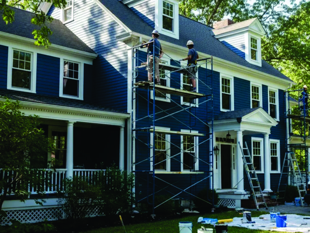 Professional painters working on residential home